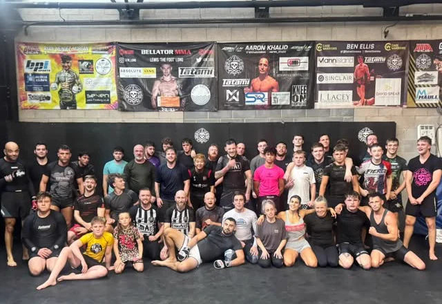 Mat Academy members, kids and coaches together on the mats